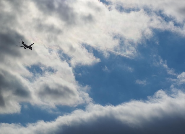 Plane silhouette over sky