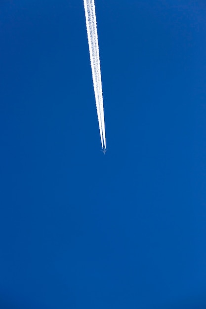 Plane in the sky, the aircraft during flight in the blue sky