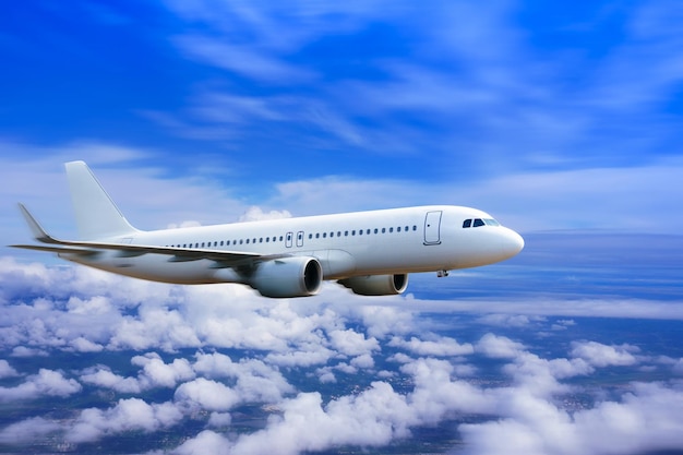 Plane in the sky Passenger commercial plane flying above the clouds concept of fast travel vacation and business