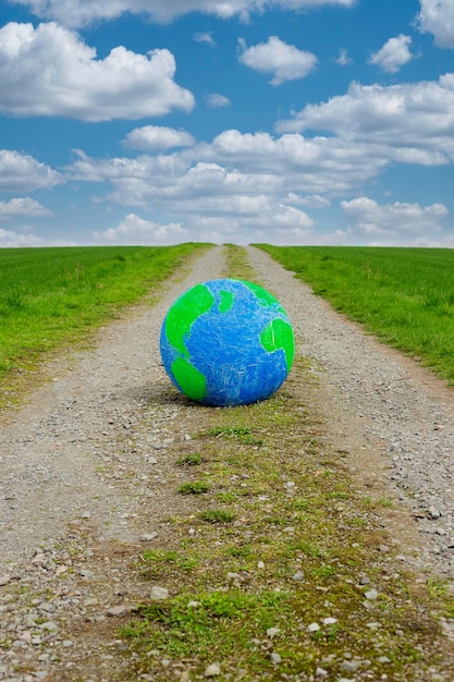 Planet Earth eco concept of nature protection Surreal image Planet on road