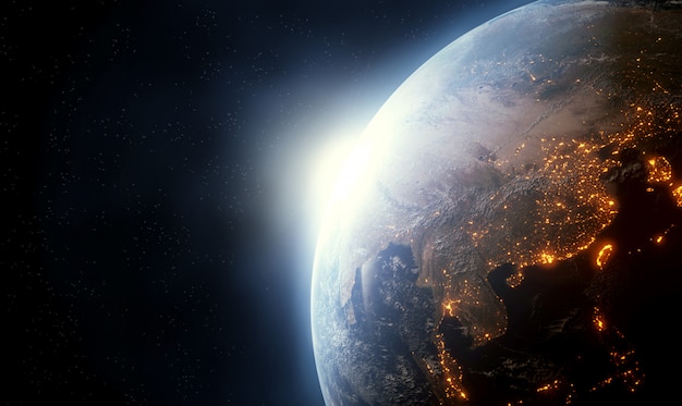 壮大な日の出のある地球。 3Dレンダリング、NASAから提供されたこの画像の要素