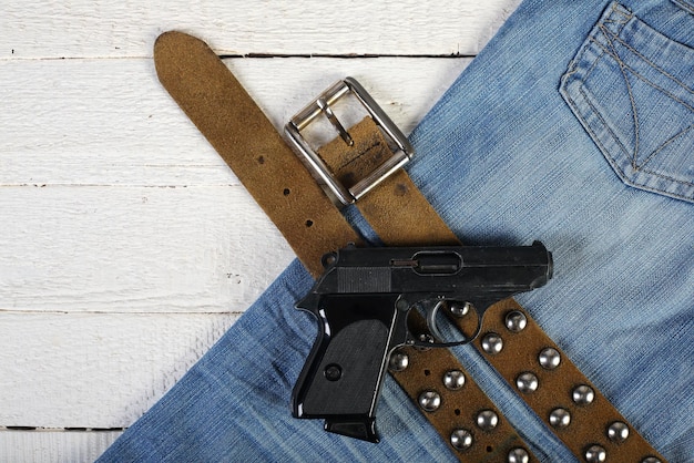 Planks phone lighter gun blue jeans and belt 2