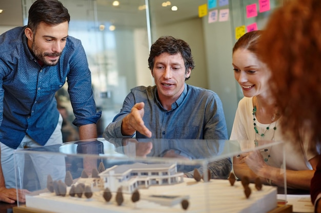 Planning around their clients specifications Shot of a group of architects having a meeting in their boardroom