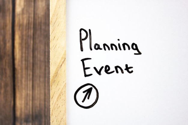 Planning event concept with black marker on white boardBusiness concept