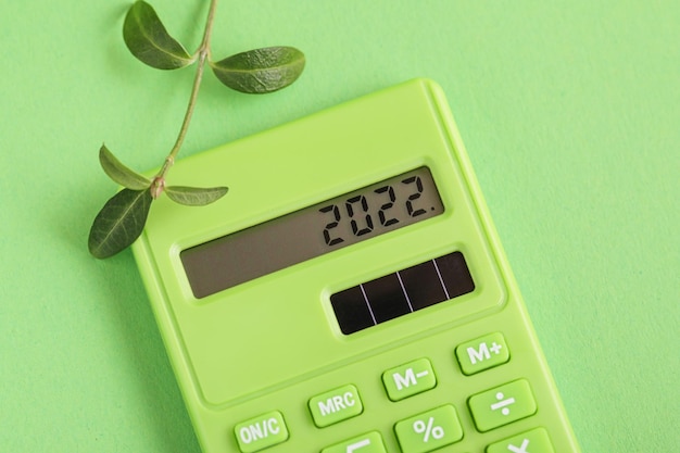 Plans 2022 on green calculator Fresh Plant Green calculator on green background