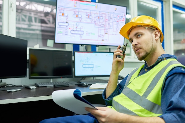 Plant Worker Giving Instructions from Office