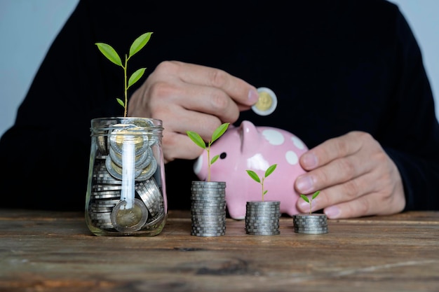 Plants are growing in jars with coins concept to save money how
to save education home loan and investment