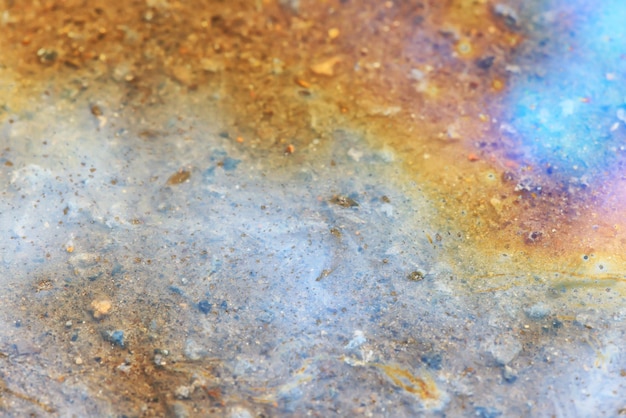 Foto plas benzine achtergrond, natte olie veelkleurige regenboog vervuiling morsen