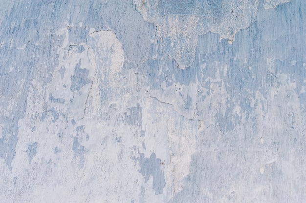 Photo plaster of blue and whitethe texture of the old cracked paint on the wall.