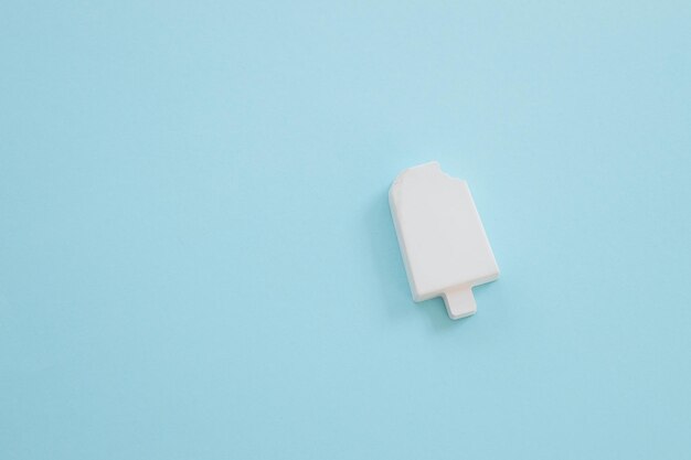 Plaster figure of ice cream on a color background