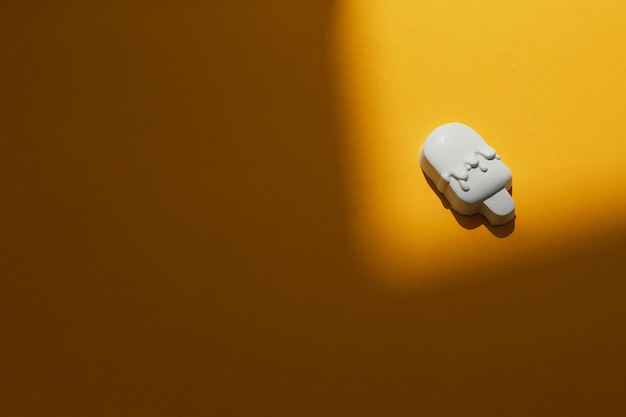 Plaster figure of ice cream on a colored background