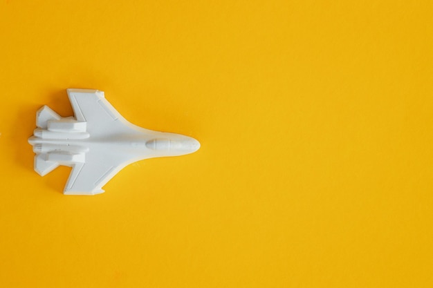 A plaster figure of a plane on a colored background