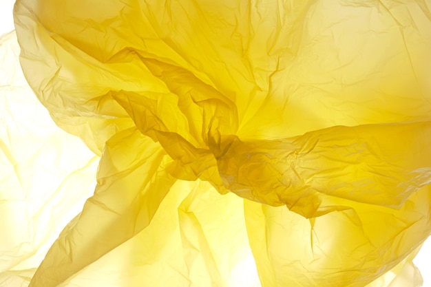 Plastic bag pattern. Backgraund polythene yellow plastic texture.