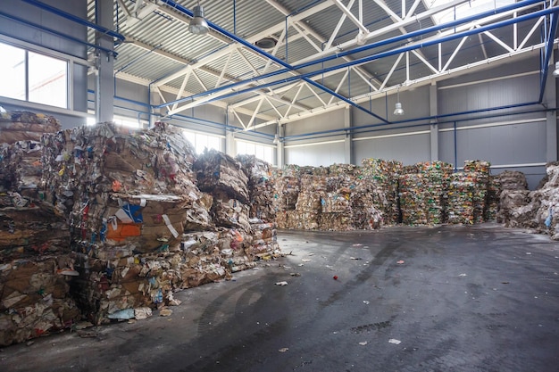 Plastic bales of rubbish at the waste treatment processing plant Recycling separatee and storage of garbage for further disposal trash sorting Business for sorting and processing of waste