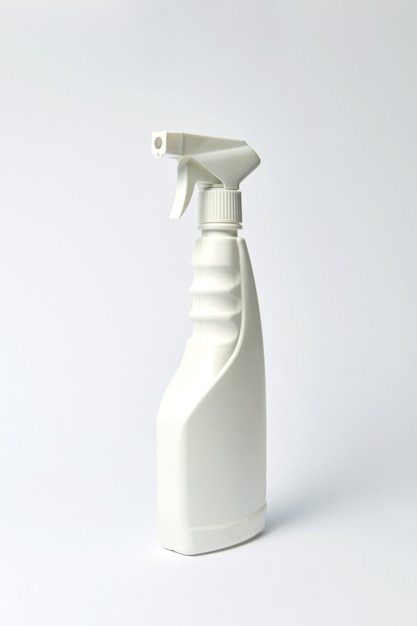 Plastic blank white bottle for liquid on a light gray background. Place for text.