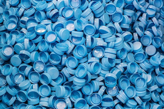 Plastic bottle caps background recycling collection and\
production processing plastic bottle caps