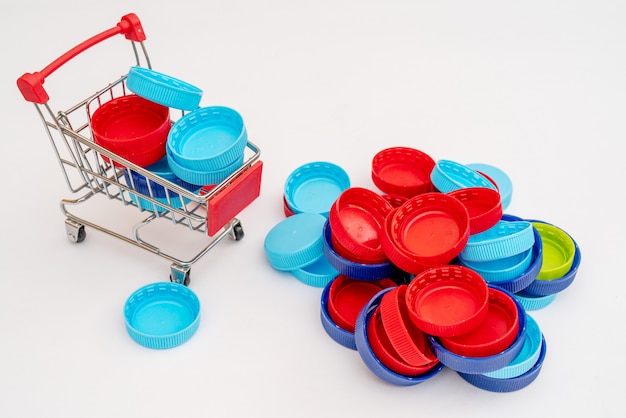 Plastic bottle caps and shopping cart