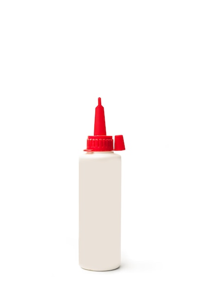 A plastic bottle of carpenter's glue on a white background with copy space