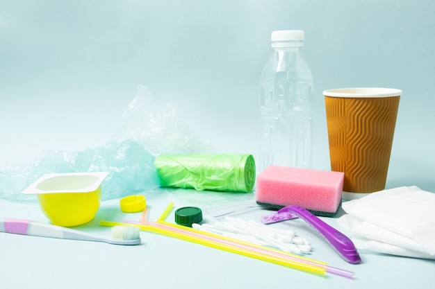 Plastic bottle, hygiene items and plastic package depicting ecological