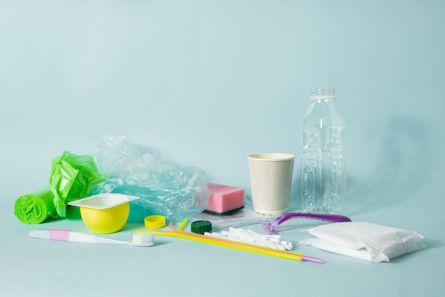 Plastic bottle, hygiene items and plastic package depicting ecological