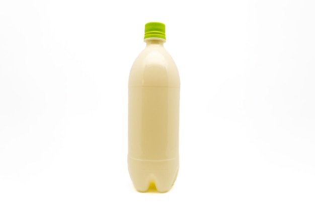 Plastic bottle with green cap isolated on white background with copy space Packaging for beverages