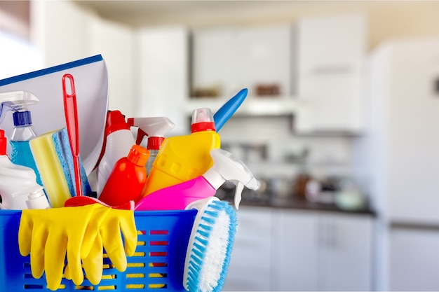 Plastic bottles, cleaning sponges and gloves  on background