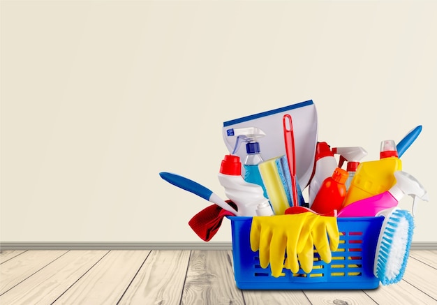 Plastic bottles, cleaning sponges and gloves  on background