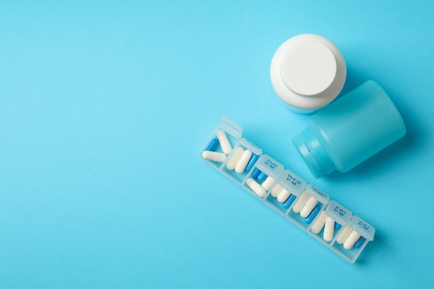 Plastic bottles and containers with pills isolated