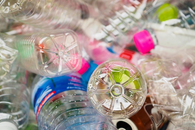 Plastic bottles in recycle trash station close up