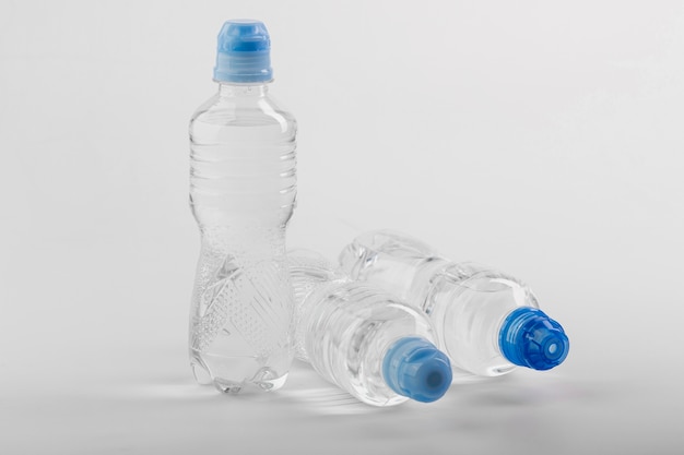 Plastic bottles of water with blue caps