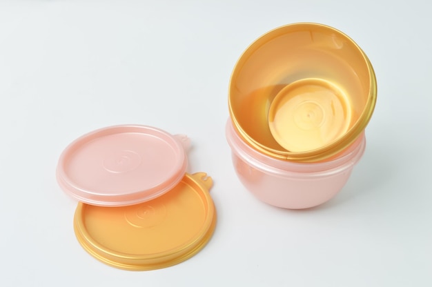 Plastic bowls with lids isolated on a white background