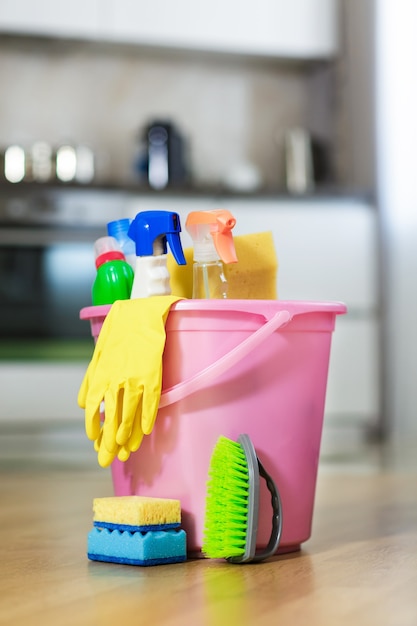 Plastic bucket with cleaning products