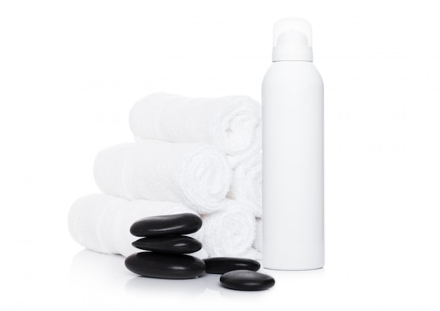 Plastic container of shampoo with spa towels