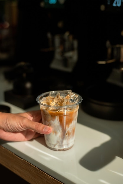 A plastic cup of ice cream with the word ice cream on it