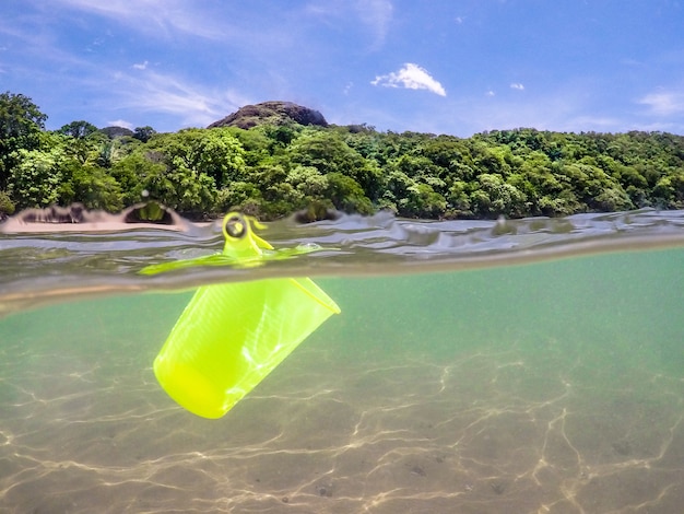 Plastic cup in the ocean, recycling