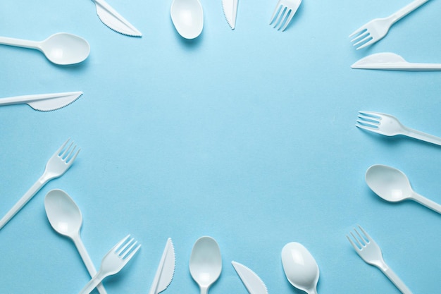 Plastic cutlery forks spoons and knives Pollution of environment with plastic and microplastics