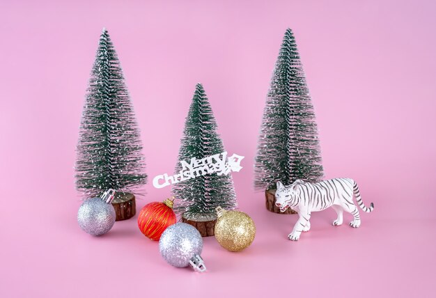 plastic figure of a white tiger christmas tree and balloons