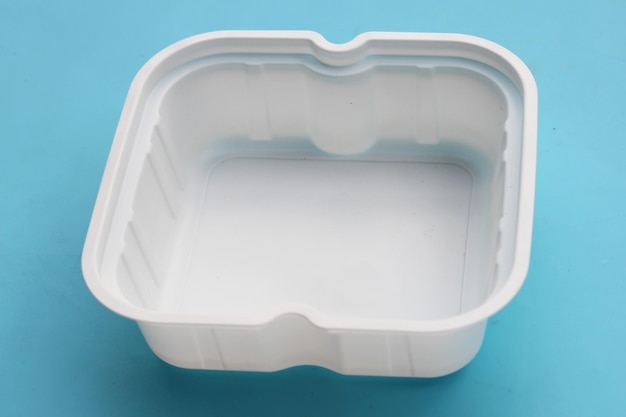 Photo plastic food packaging on blue background