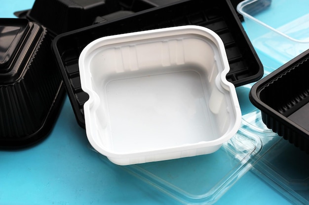 Plastic food packaging on blue background