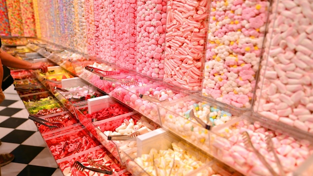 Photo plastic jars filled with colourful candy in shop