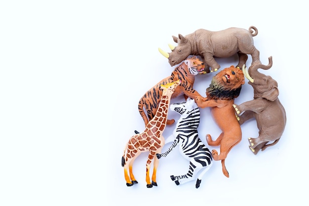 Photo plastic jungle animal toys on white background