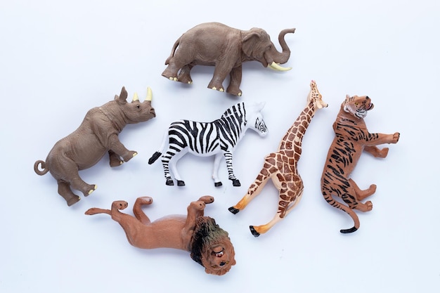 Photo plastic jungle animal toys on white background