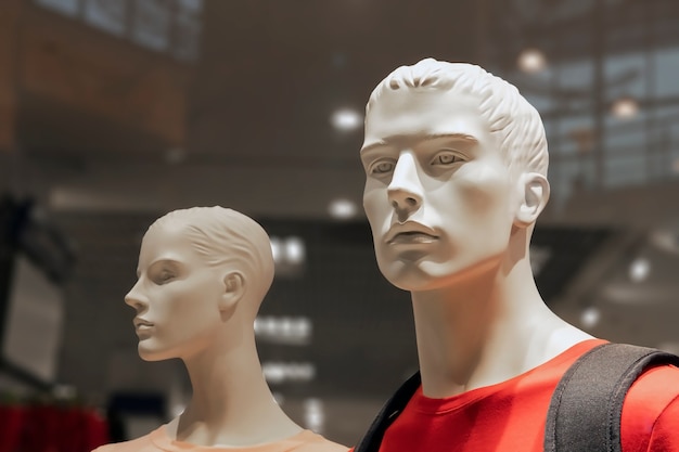 Plastic mannequins dressed in fashionable clothes