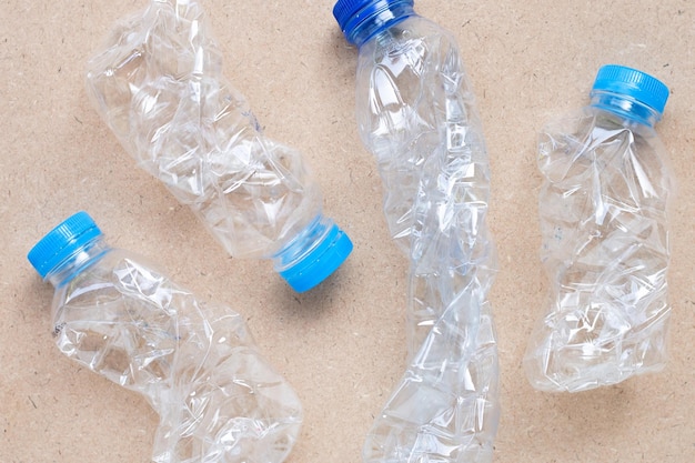 Plastic milk bottles on brown background