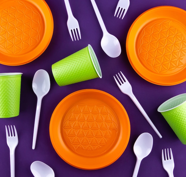 Plastic orange green waste collection on purple 