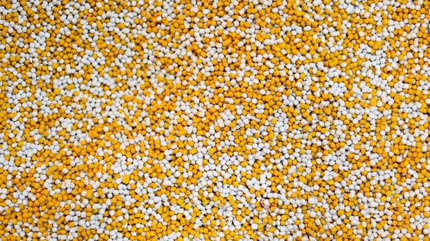 Plastic pellets white and yellow for texture background material design