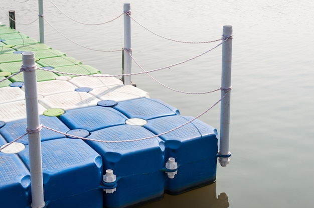 Plastic pontoon with the rope fence.