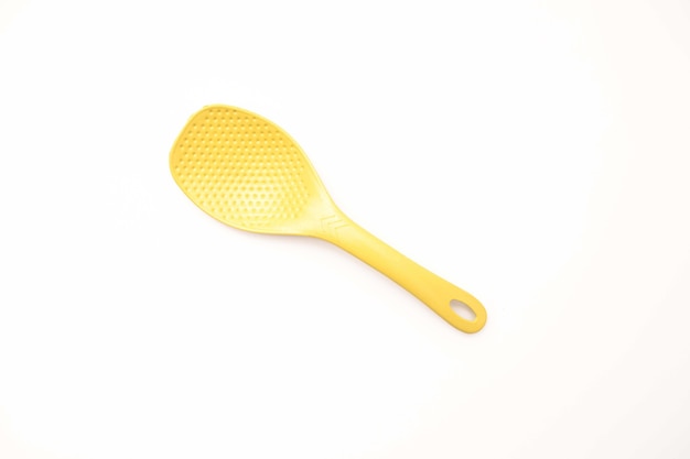 plastic rice paddle spoon isolated on a white background