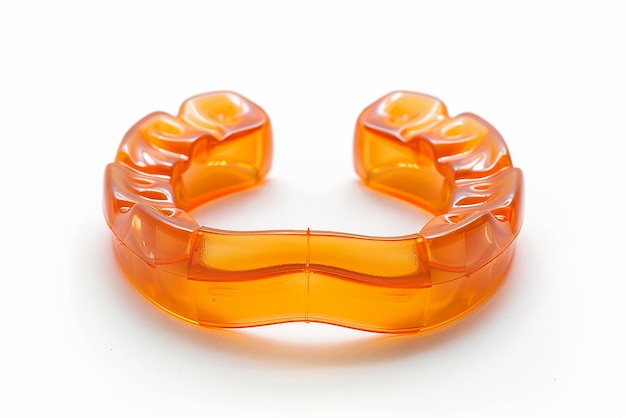 a plastic ring with orange plastic beads on it