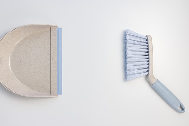 Plastic scoop set dustpan and hand brush on white